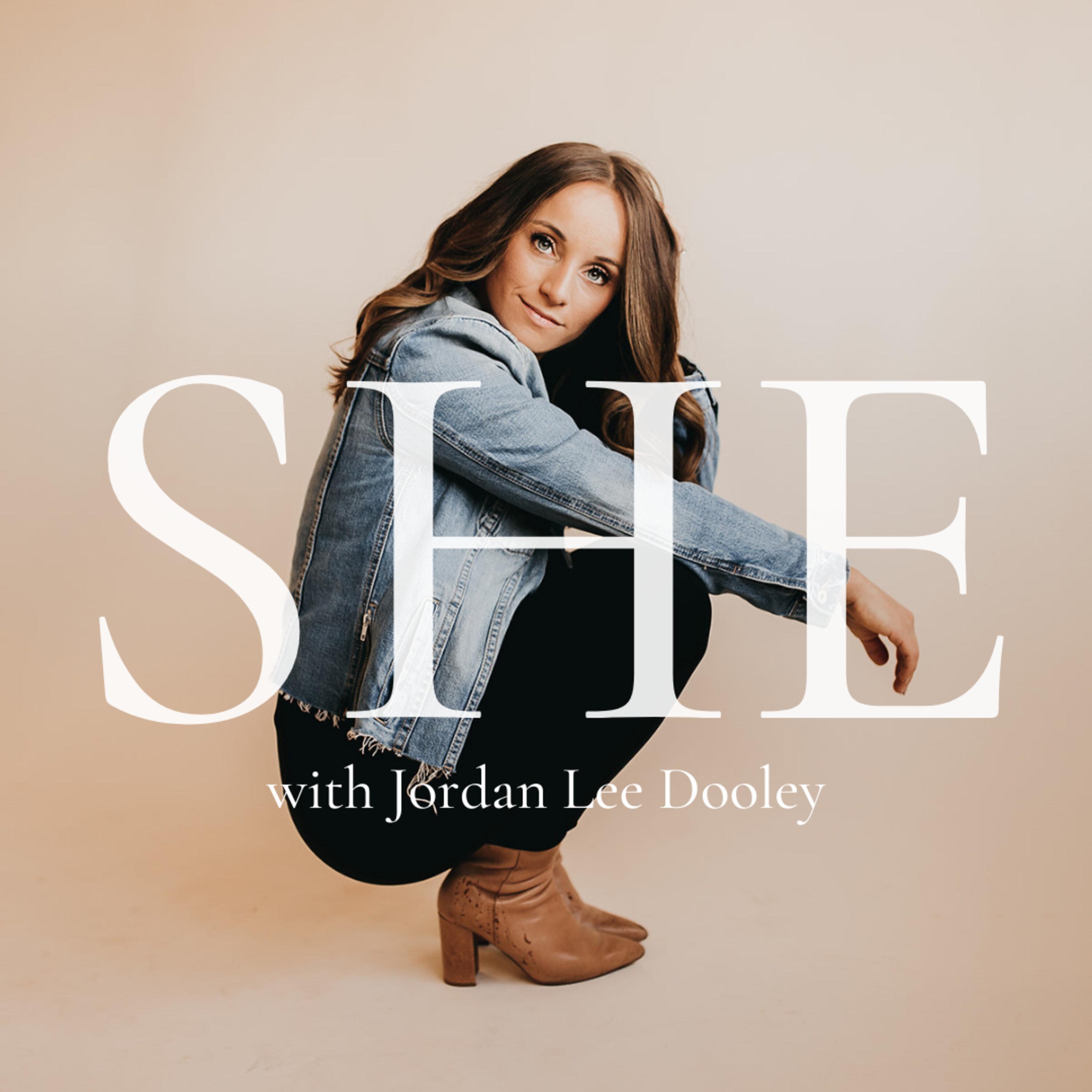 Show poster of SHE  with Jordan Lee Dooley